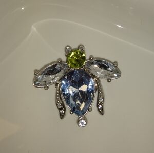 Elegant Silver Insect with Blue and Green Gems